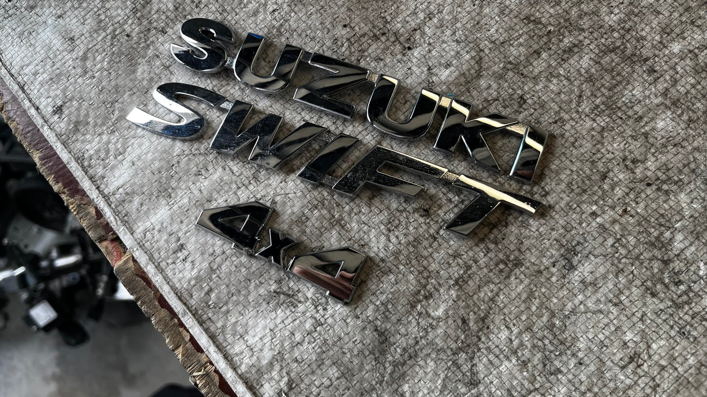 Suzuki Swift 4X4 емблеми